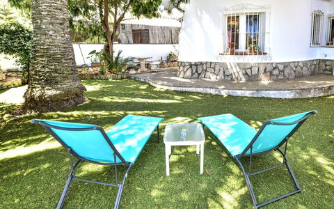Club San Juan: Residential Area, Shrub, Roof, Home, Cottage, Driveway, Estate, Siding, Landscaping, Yard