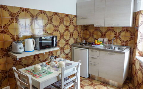 Il Piccolo Nocelleto: Room, Property, Furniture, Interior Design, Kitchen, Building, House, Wall, Floor, Yellow