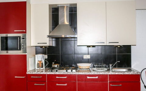 Bungalowpark Landsrade: Kitchen, Kitchen Appliance, Major Appliance, Cabinetry, Countertop, Kitchen Stove, Flooring, Stove, Furniture, Cupboard