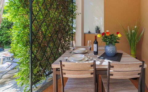 Tea: Table, Plant, Property, Furniture, Chair, Flower, Wood, Interior Design, Orange, Flooring