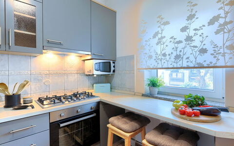 Tea: Cabinetry, Property, Countertop, Furniture, Kitchen, Table, Kitchen Stove, Kitchen Appliance, Interior Design, Orange