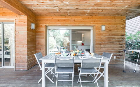 Porto Vecchio 150: Table, Furniture, Chair, Building, Wood, Plant, Shade, Tree, Interior Design, Wood Stain