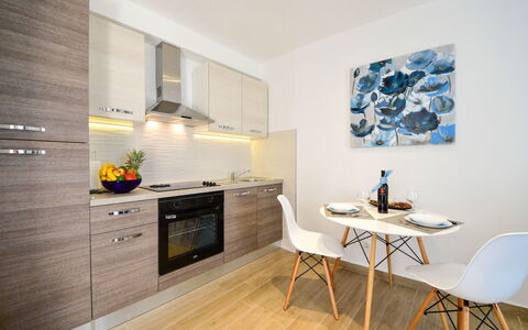 Matea: Cabinetry, Furniture, Countertop, Building, Kitchen Stove, Wood, Table, Interior Design, Kitchen, Flooring