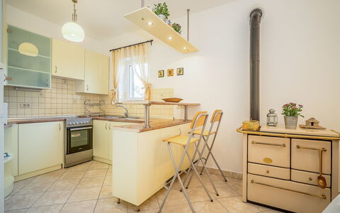Mila: Room, Furniture, Property, Yellow, Floor, Interior Design, Kitchen, Building, Cabinetry, House