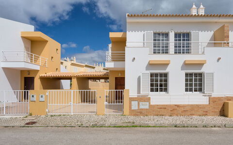 Sunny Home: Property, House, Home, Building, Residential Area, Yellow, Real Estate, Architecture, Town, Facade