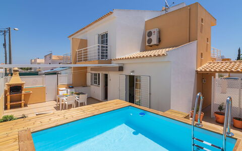 Sunny Home: Building, Property, Sky, Window, Swimming Pool, Water, Azure, Shade, House, Lighting
