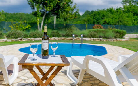 Villa Malini: Table, Plant, Cloud, Furniture, Property, Sky, Water, Bottle, Tree, Azure