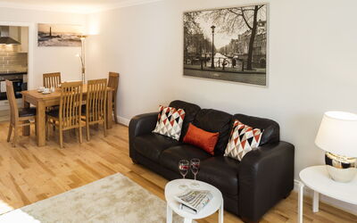 Dublin 210: Table, Furniture, Property, Couch, Comfort, Wood, Interior Design, Lighting, Picture Frame, Studio Couch