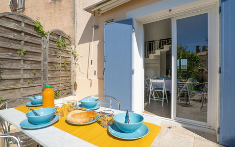 Pescadou: Furniture, Property, Table, Chair, Window, Plant, Blue, Building, Azure, Tableware