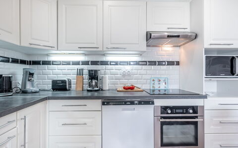 Les Alizés: Countertop, Cabinetry, Kitchen, White, Room, Furniture, Property, Interior Design, Kitchen Stove, Drawer