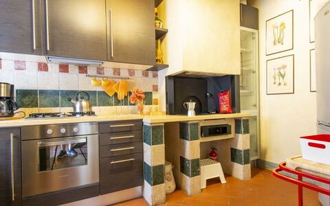 Tassinaia: Cabinetry, Furniture, Countertop, Kitchen Appliance, Kitchen Stove, Gas Stove, Interior Design, Kitchen, Picture Frame, Wood