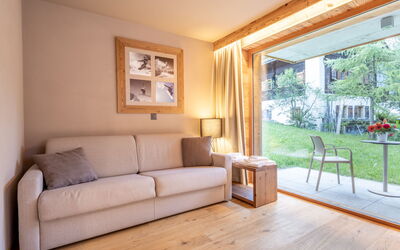 Swisspeak Resorts Zinal 9000.104: Interior Design, Furniture, Flooring, Floor, Wood, Couch, Room, Ceiling, Living Room, Chair