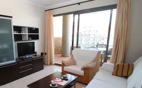 Torre Maestral: Table, Furniture, Property, Comfort, Building, Lighting, Couch, Wood, Living Room, Interior Design