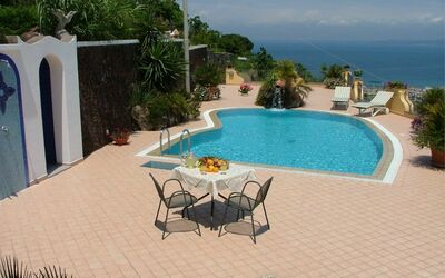 Villa Rosalia: Water, Furniture, Building, Plant, Sky, Table, Swimming Pool, Azure, Seaside Resort, Outdoor Furniture