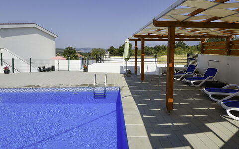 Nina: Sky, Building, Blue, Shade, House, Flooring, Leisure, Swimming Pool, Wood, Roof