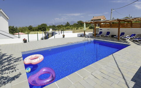 Nina: Water, Sky, Cloud, Building, Swimming Pool, Azure, House, Shade, Outdoor Furniture, Flooring