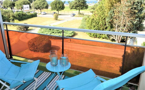 Port Blanc: Plant, Property, Green, Tree, Blue, Azure, Building, Outdoor Furniture, Shade, Chair