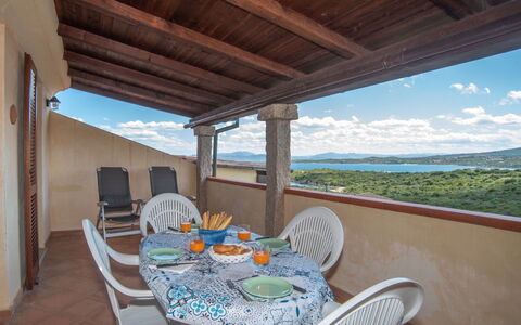 Giuly: Sky, Furniture, Property, Table, Chair, Light, Cloud, Azure, Shade, Porch