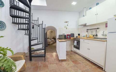 Cueva de Lindaraja: Plant, Property, Cabinetry, Building, Interior Design, Architecture, Wood, Flooring, Stairs, Floor