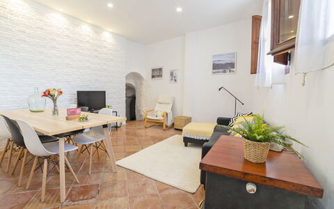 Cueva de Lindaraja: Table, Plant, Property, Furniture, Houseplant, Chair, Lighting, Interior Design, Architecture, Living Room