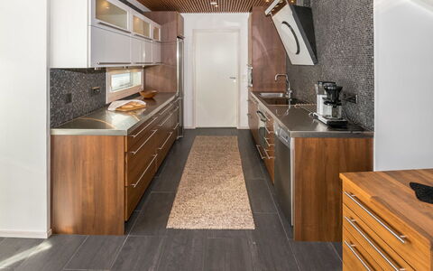 Villa Kaivopuisto: Flooring, Kitchen, Countertop, Wood, Interior Design, Furniture, Floor, Ceiling, Cabinetry, Major Appliance