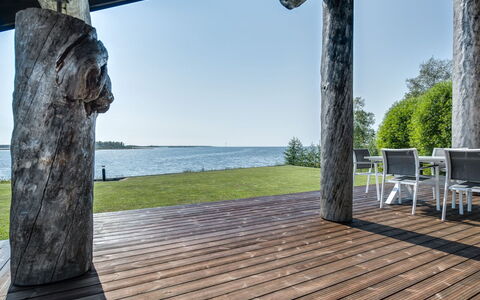 Villa Pärla: Furniture, Chair, Outdoor Furniture, Table, Wood, Outdoor Table, Kitchen & Dining Room Table, Shade, Garden, Umbrella