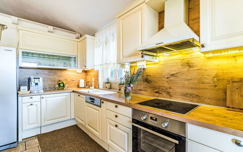 Villa Mutnik: Kitchen, Wood, Major Appliance, Kitchen Appliance, Countertop, Cabinetry, Home, Flooring, Interior Design, Home Appliance