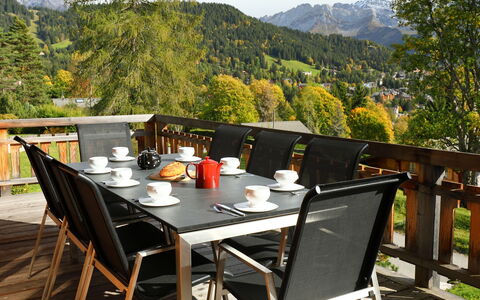 Chalet Maurice: Table, Plant, Sky, Furniture, Tableware, Property, Chair, Tree, Outdoor Table, Wood