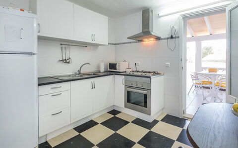 Voramar 2: Property, Room, Kitchen, Furniture, Floor, Cabinetry, Kitchen Stove, Interior Design, Building, Yellow
