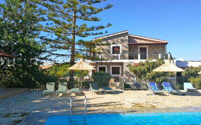 Hersonissos 3: Sky, Water, Building, Property, Plant, Window, Shade, Swimming Pool, Tree, Outdoor Furniture