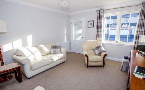 Devonvale Place: Furniture, Couch, Picture Frame, Window, Azure, Interior Design, Building, Comfort, Floor, Flooring