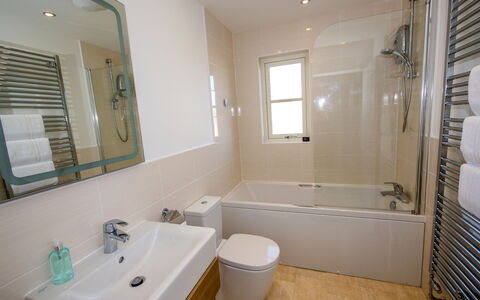 Devonvale Place: Mirror, Plumbing Fixture, Bathtub, Tap, Sink, Property, Bathroom, Building, Bathroom Cabinet