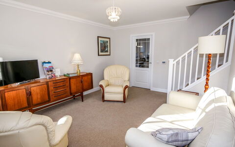 Devonvale Place: Furniture, Comfort, Lighting, Television, Interior Design, Living Room, Floor, Picture Frame, Flooring, Building