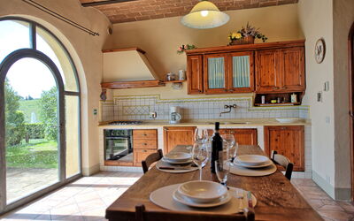 Glicini 1: Property, Furniture, Cabinetry, Countertop, Tableware, Wood, Interior Design, Kitchen, Table, Lighting