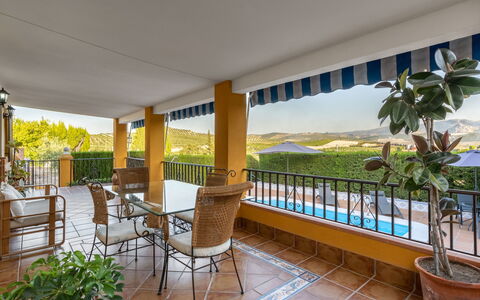 Villa San Vicente: Plant, Property, Furniture, Flowerpot, Building, Table, Porch, Chair, Shade, Houseplant