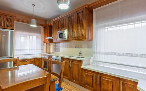 Villa San Vicente: Cabinetry, Property, Furniture, Building, Countertop, Window, Table, Kitchen, Wood, Kitchen Appliance