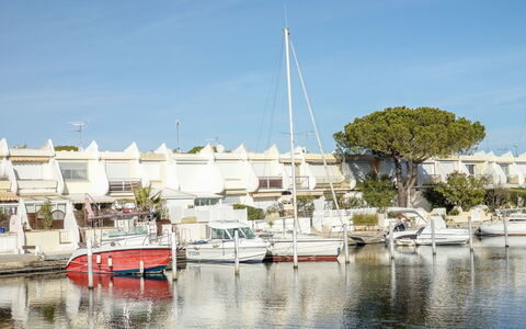 Marinas Beach: Marina, Water Transportation, Water, Sky, Boat, Reflection, Vehicle, Harbor, Waterway, Tree