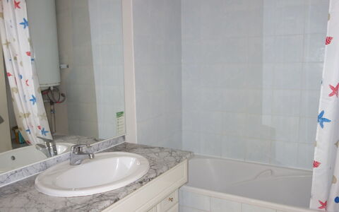 La Marina: Bathroom, Property, Room, Tile, Wall, Shower Curtain, Bathroom Accessory, Curtain, Interior Design, House