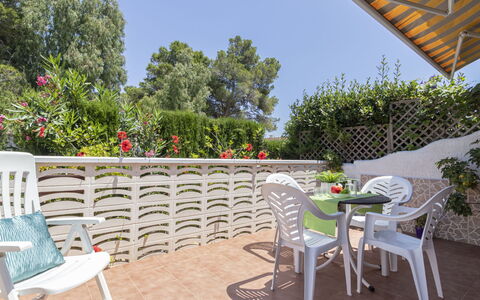 Coquetó: Sky, Furniture, Property, Plant, Table, Chair, Building, Flower, Shade, Outdoor Furniture
