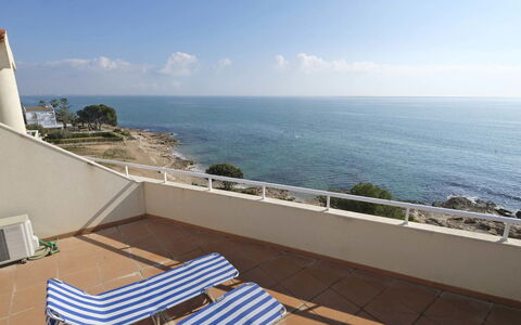 Ona de Mar: Water, Sky, Cloud, Building, Azure, Seaside Resort, Coastal And Oceanic Landforms, Shade, Outdoor Furniture, Wood