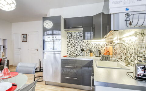 Asfeld: Cabinetry, Countertop, Building, Tap, Lighting, Kitchen, Interior Design, Clock, Wood