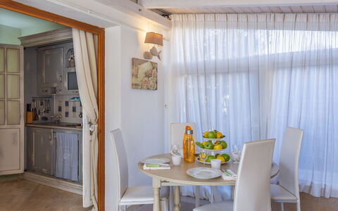Stella Marina: Room, Property, Curtain, Interior Design, Dining Room, Furniture, Ceiling, Building, Yellow, Window Treatment