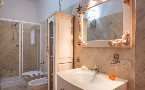 Stella Marina: Bathroom, Room, Property, House, Interior Design, Real Estate, Bathtub, Building, Bathroom Cabinet, Tile