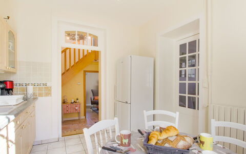 Le Petit Biyou: Table, Food, Cabinetry, Chair, Tableware, Wood, Lighting, Orange, Floor, Flooring