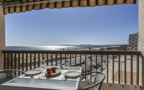 Canigó: Water, Table, Sky, Furniture, Property, Building, Tableware, Chair, Azure, Wood