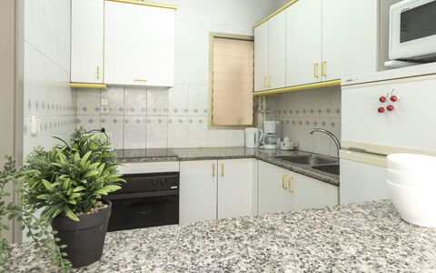 Golf Sant Jordi: Countertop, Room, Property, Kitchen, Tile, Cabinetry, Furniture, Interior Design, Floor, Yellow