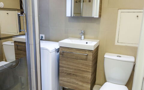 Sun Beach: Bathroom, Property, Room, Plumbing Fixture, Floor, Bathroom Cabinet, Bathroom Accessory, Bathroom Sink, Wall, Toilet