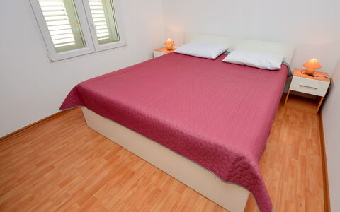 Korčula Vela Luka 107: Property, Furniture, Building, Comfort, Window, Wood, Orange, Rectangle, Pillow, Bed Frame