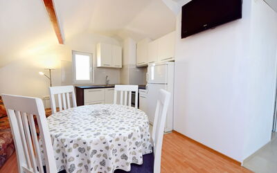 Korčula Vela Luka 107: Table, Property, Furniture, Wood, Building, Textile, Interior Design, Chair, Flooring, Kitchen & Dining Room Table