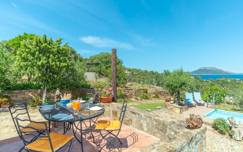 Iride: Water, Sky, Cloud, Plant, Property, Furniture, Table, Chair, Outdoor Furniture, Tree
